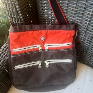 Sherpani orange and brown c Crossbody bag 12 x 12” an excellent used condition